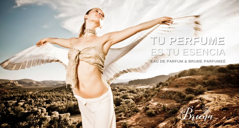 Mujer con alas en un paisaje desértico, publicidad de la fragancia Tu Perfume Esencia
